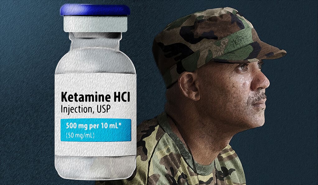 A soldier is looking at the bottle of vitamin supplement.